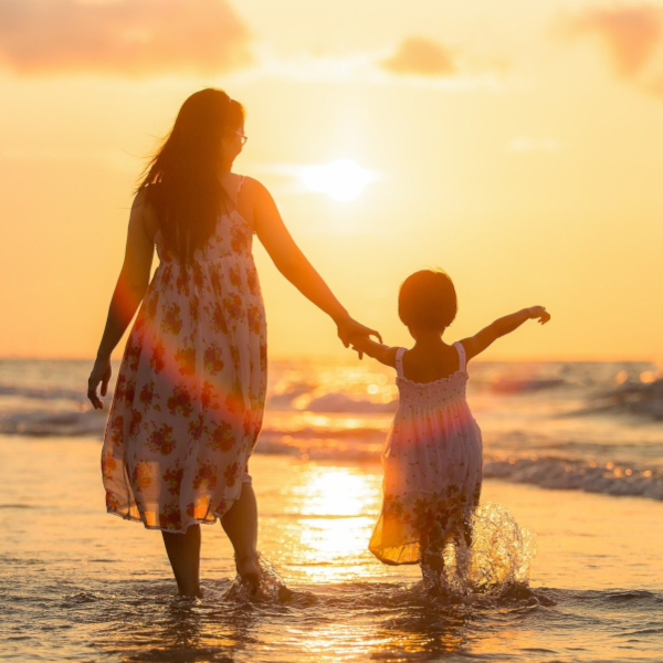 Mother with child at the beach