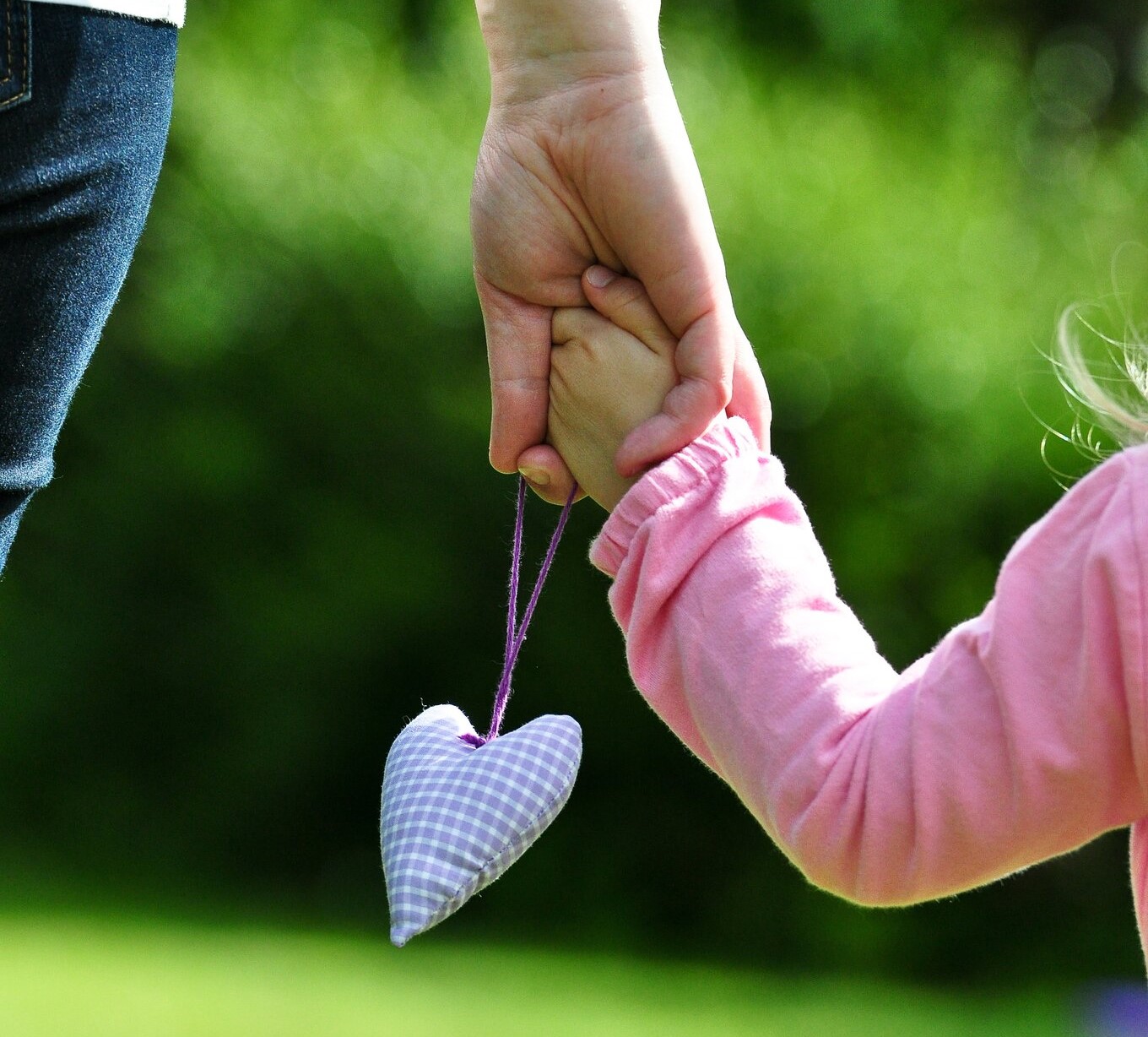 Mother and child holding hands
